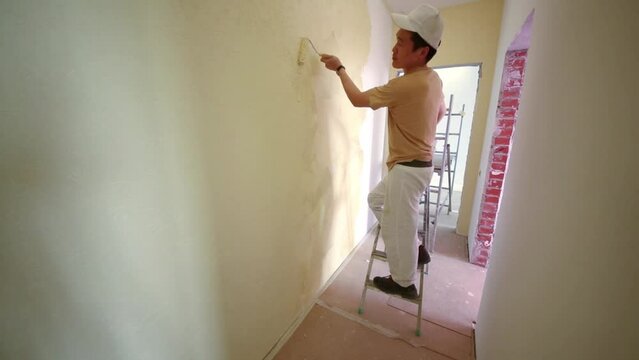 Professional builder is making finish in the apartment.