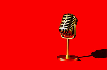 Golden retro microphone vintage style isolated on red background.