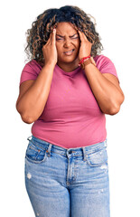 Young african american plus size woman wearing casual clothes with hand on head, headache because stress. suffering migraine.
