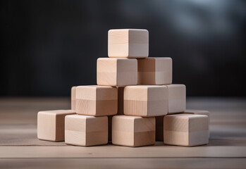 Obraz premium Stack of wooden building blocks - concept of structure and consistency