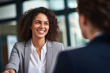 Obraz premium Smiling businesswoman in a meeting
