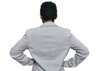 Young african american woman wearing business clothes standing backwards looking away with arms on body