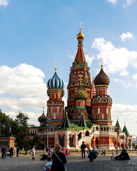 Fototapeta na wymiar View of St. Basil's Cathedral from Red Square. People are relaxing and sightseeing.