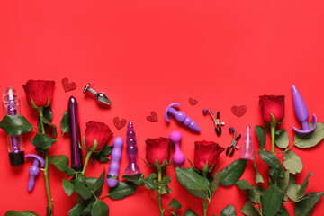 Composition with beautiful rose flowers and different sex toys on red background