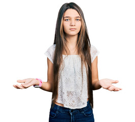 Young brunette girl with long hair wearing white shirt clueless and confused with open arms, no idea concept.