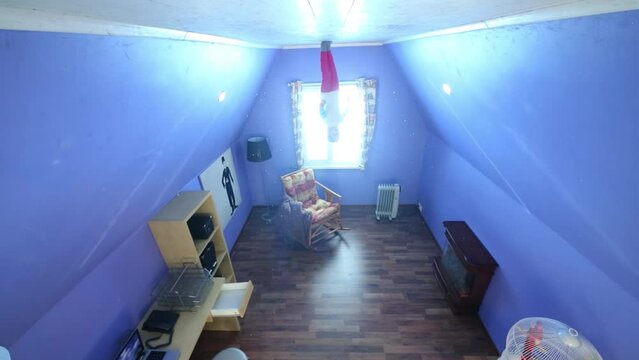 Little girl jumps on ceiling upside down at inverted house