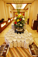 hundreds of white cups arranged neatly
