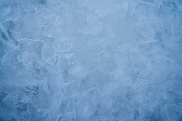 Icy winter background cracked grunge texture. Natural scratched ice on a skating rink as a texture...