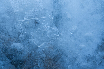 Icy winter background cracked grunge texture. Natural scratched ice on a skating rink as a texture...