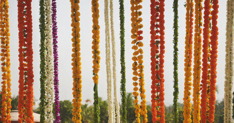 An isolated image of a beautiful Diwali garland, featuring vibrant orange and green flowers.