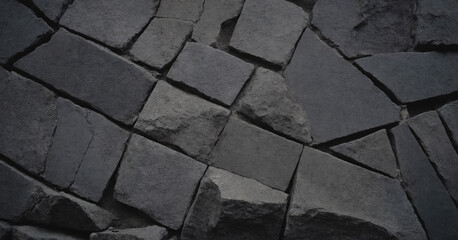A close-up of dark basalt texture, a vintage backdrop showcasing the intricate patterns of black and gray.