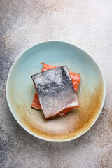 Pieces of smoked salmon on a plate. Close-up