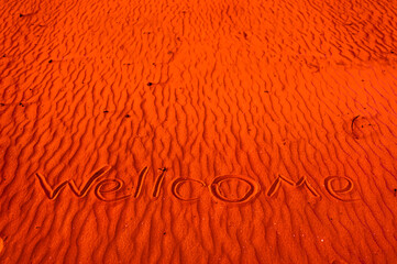 On the red Martian sand is the inscription 