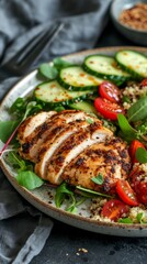 Plate of Food With Chicken, Cucumbers, and Tomatoes