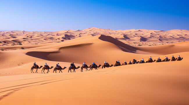 Caravan travelling over dunes in the desert
