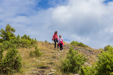 Family Hiking Adventure in Mountain Landscape
