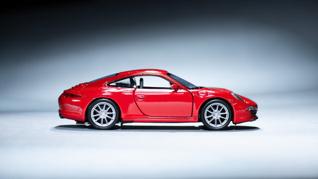 Gothenburg, Sweden - May 26 2021: Side view of a red Porsche 911 model car.