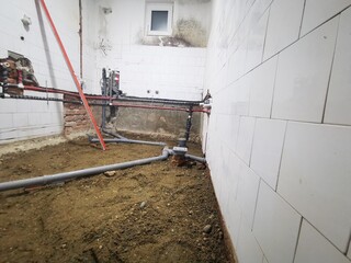 Bathroom construction at renovated home. Installation of pipes in bathroom. pipe line inside wall 