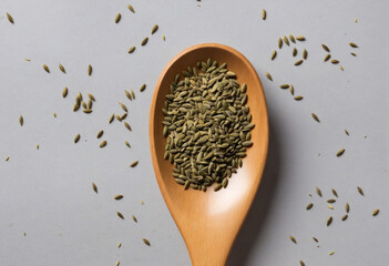 Dill seeds on wooden spoon, blank space - obrazy, fototapety, plakaty