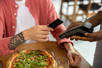 Close up picture of mans hand holding credit card