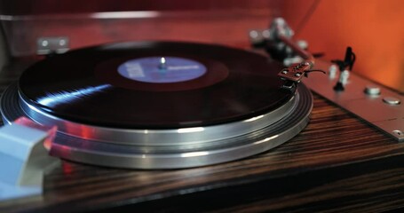 80s turntable, a vinyl rotates on the platter, vintage hi fi components