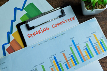 Concept of Steering Committee write on paperwork isolated on wooden background.