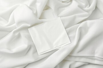A piece of paper sitting on top of a white sheet. Can be used as a background or for a variety of office and educational concepts