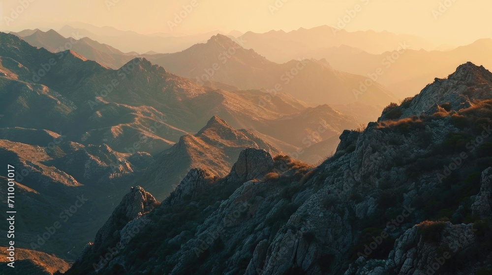 Poster a breathtaking view of a mountain range illuminated by the warm colors of a sunset. perfect for natu