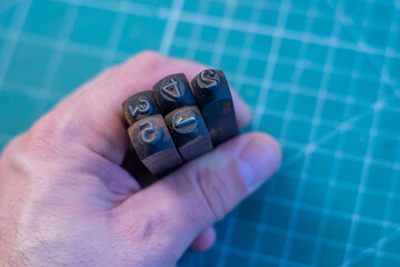 Metal punches for stuffing numbers on iron.A set of percussion stamps.Digital carbide stamps.
