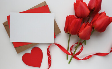 Happy Valentine's Day card. bouquet of tulips and red valentines heart