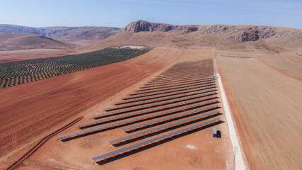 Aerial View of Solar Panels on Arid Farmland Landscape