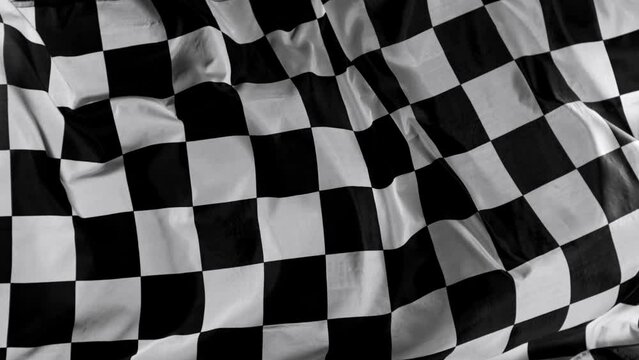 Checkered Race Flag. Slow Motion Wavy closeup fabric fluttering Racing Flag background. Formula One flag car motor sport.