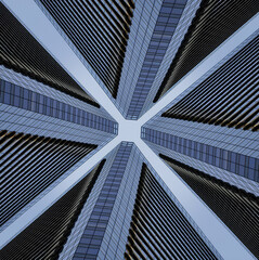photo de 4 bâtiments vertigineux vue du sol donnant un effet d'infini