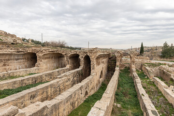 Fototapeta na wymiar Dara Ancient City. Dara aqueducts, tare cisterns. Ancient Water Channels in the Ancient City of Dara in Mardin, Turkey.