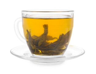 Fresh green tea in glass cup, leaves and saucer isolated on white
