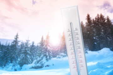 Thermometer showing temperature below zero outdoors on winter day