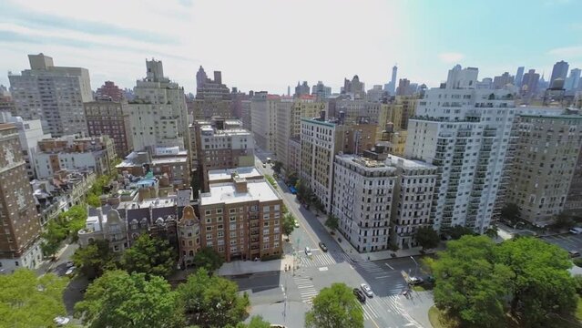 Cars ride by crossroad of Riverside Drive and West 79th street