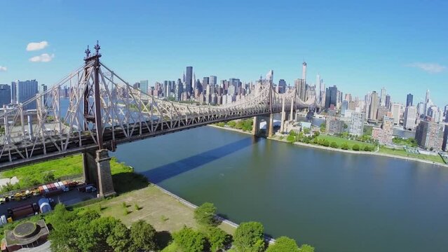 Transport traffic on Queens Bridge over East River at summer 