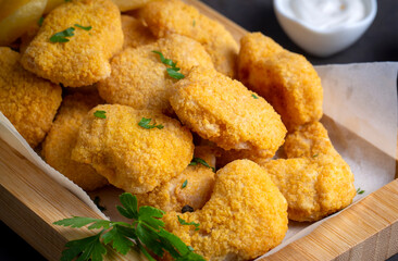 Delicious chicken nuggets and chips.