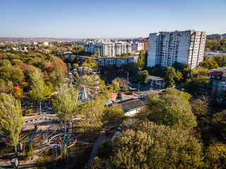 Fototapeta na wymiar aerial view of amusement park with ferris wheel in chisinau