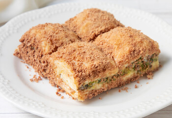 Traditional turkish new dessert cold milky baklava with pistachio (Turkish name; soguk baklava)