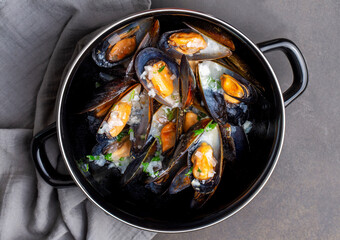 Delicious seafood mussels with parsley sauce and lemon. Delicious steamed mussels.