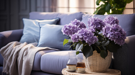Light stylish furniture, blue and violet armchair with decorative pillow and flowers, home style