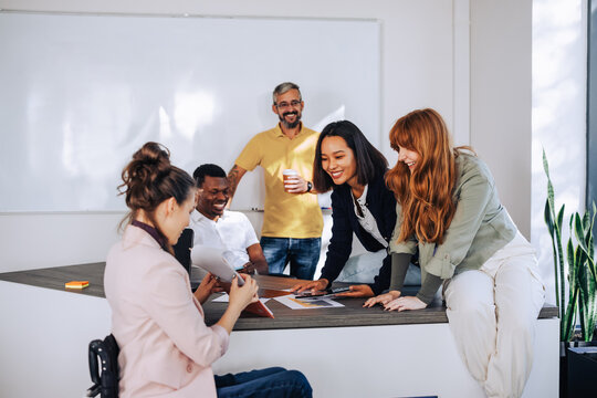 A diverse inclusive businesspeople having briefing at boardroom.