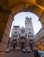 View of Cathedral of San Lorenzo, main religious building of city of Genoa in twilight - obrazy, fototapety, plakaty