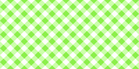 Gingham or vichy pattern with diagonal green and white squares. Checkered background. Spring or summer tablecloth, napkin, towel, handkerchief texture. Wrapping paper print. Picnic plaid design.