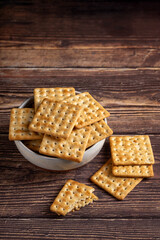 Crispy crackers in bowl. Crispy dry biscuits.