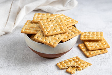 Crispy crackers in bowl. Crispy dry biscuits.