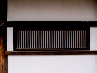 Beautiful window wood paneling in classical style at Kasuga Taisha Shrine in Nara, Japan.