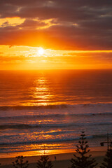 Fototapeta premium Golden Sunrise Over Gold Coast Beach